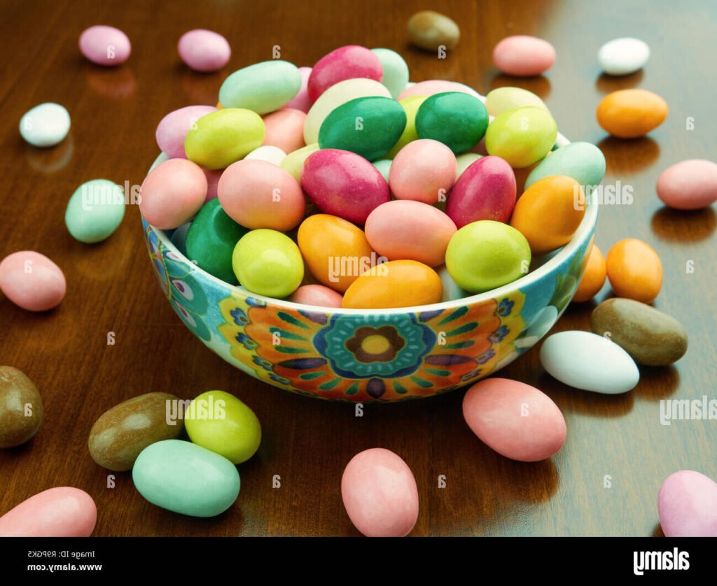 assiette de dragees colorees sur une table