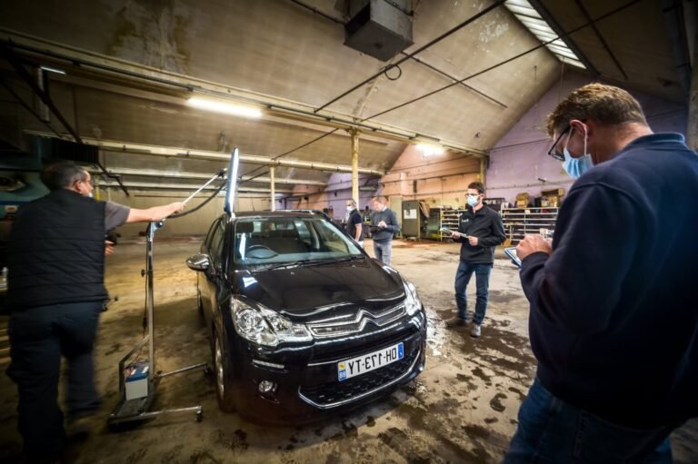 renault remiremont devant un garage automobile